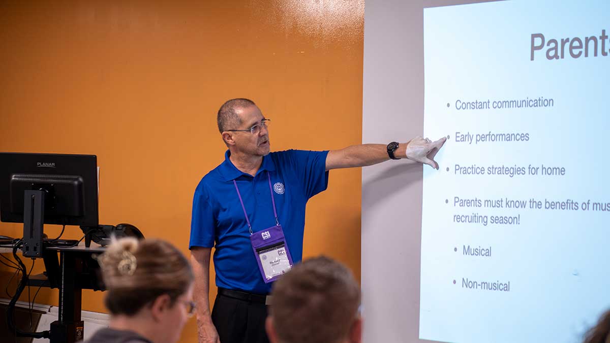 Richard Saucedo pointing out key points in his slide at the Conn-Selmer Institute.