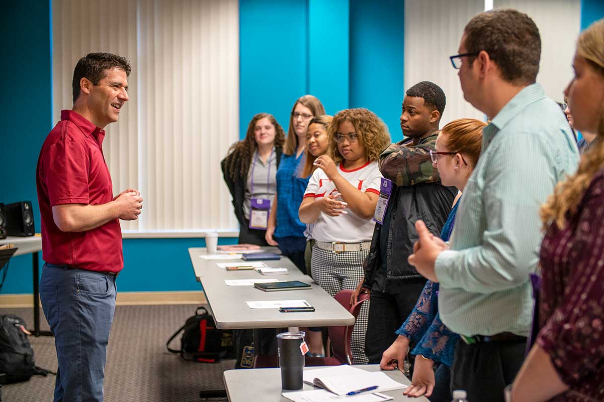 Matthew Arau leading a group activity at the Conn-Selmer Institute.