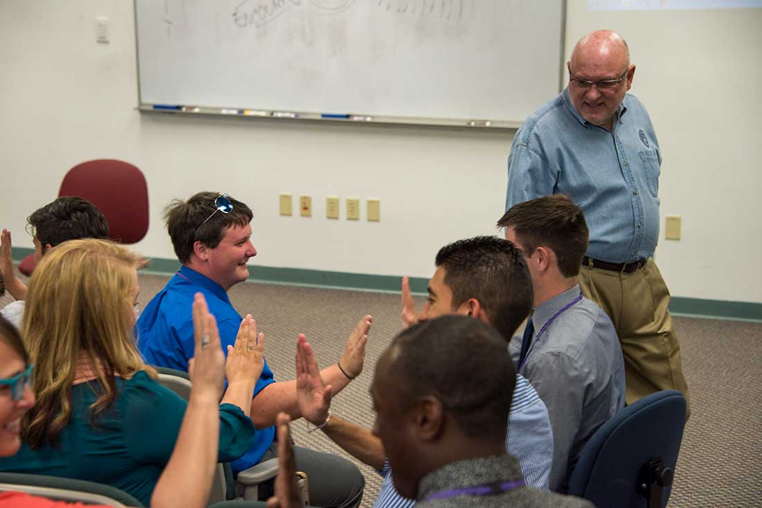 Tim Lautzenheiser conducting a group activity at the Conn-Selmer Institute.